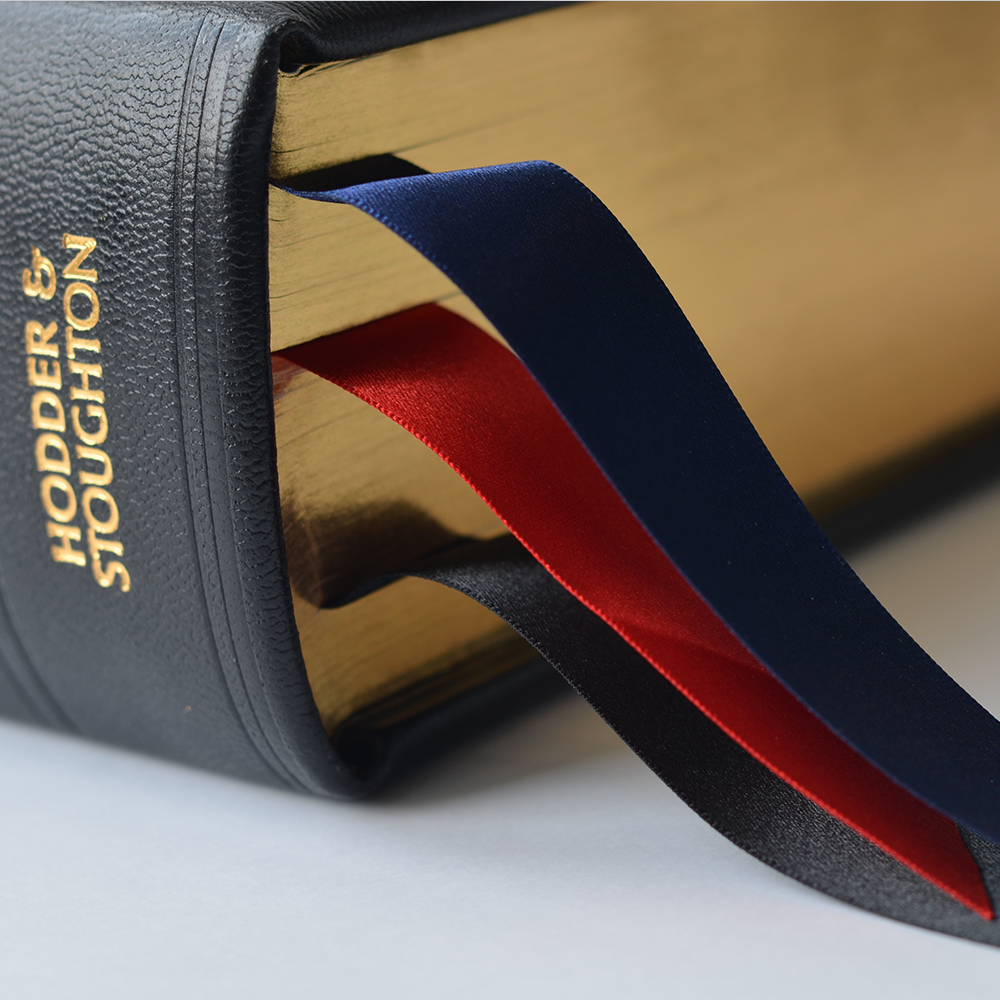 Close up on gilded edges and marker ribbons.